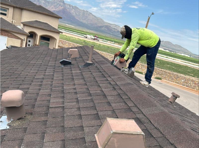 Experienced roofers in Horizon, TX, installing a residential asphalt shingle roof with precision.
