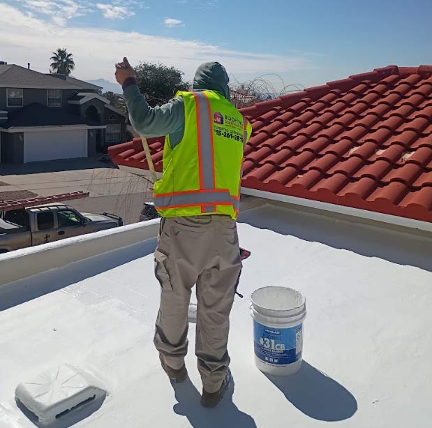 Finished energy-efficient residential roof coating on a home in Horizon, providing UV protection.