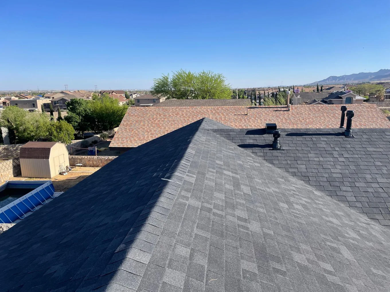 Professional asphalt shingle roof replacement on a residential home in El Paso, featuring high-durability GAF shingles installed by JM Roofing.